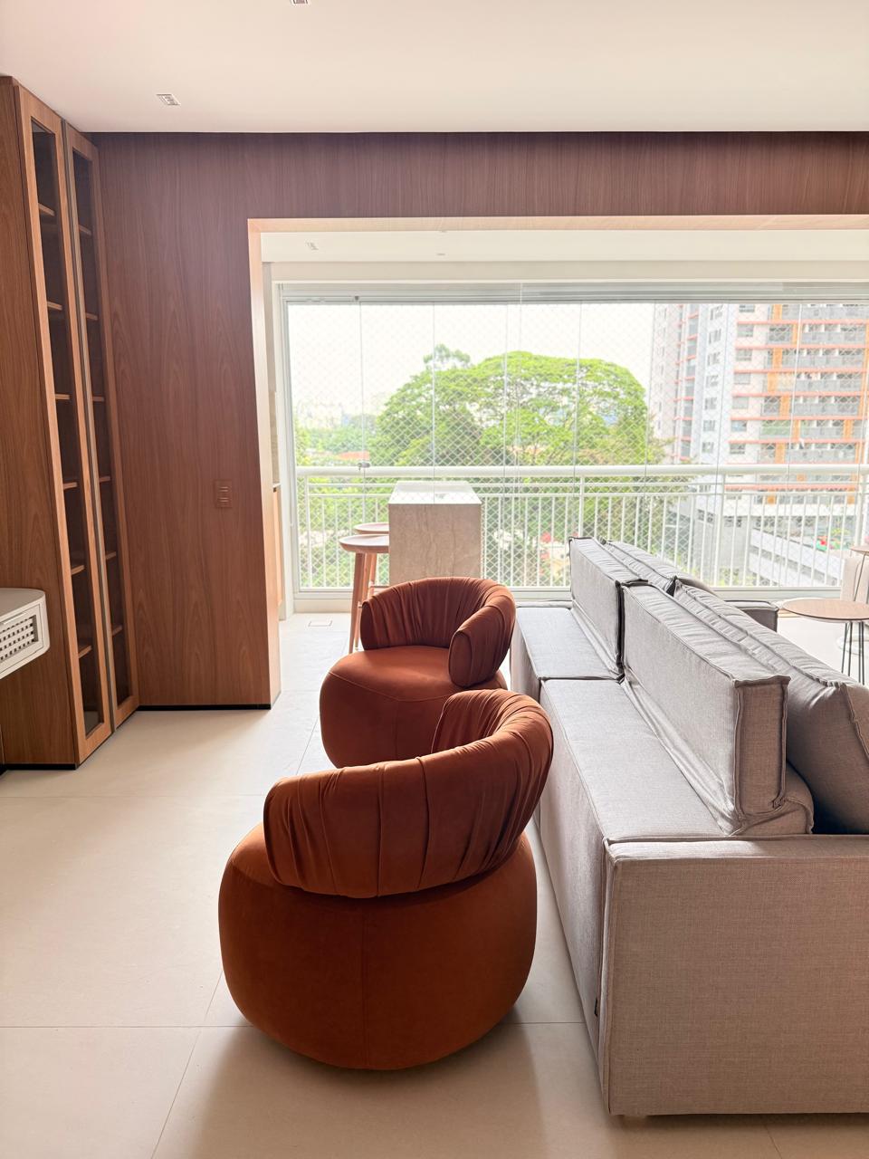 Projeto Santo Amaro: Sala de estar com acesso à varanda.